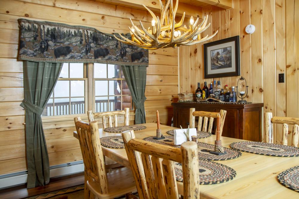 The Brentwood Log Cabin Surrounded by Trees Looks Like the Perfect Log Home